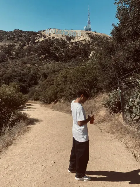 Samiel on a trail beneath the Hollywood sign